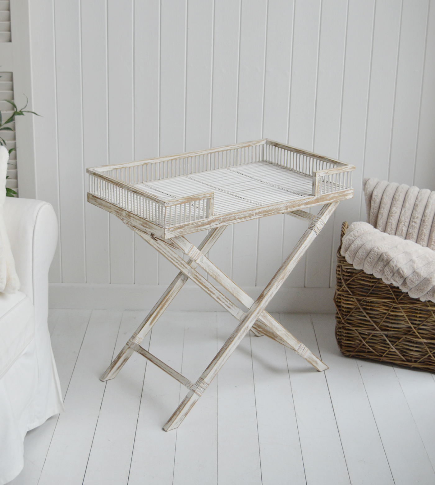 The Provincetown Table, a White wash beach house tray table, and ideal piece of furniture for coastal homes and interiors - a photograph of the table from the side