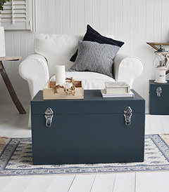 A set of two large different sized Newbury rectangle trunks in a luxurious dark blue grey colour in a matt finish with contrasting silver handles and clasps. The White Lighthouse New England Coastal and Country furniture and interiors. Bathroom, Living Room, Bedroom and Hallway Furniture for beautiful homes bedside table 