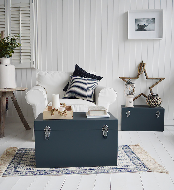 A set of two large different sized Newbury rectangle trunks in a luxurious dark blue grey colour in a matt finish with contrasting silver handles and clasps. The White Lighthouse New England Coastal and Country furniture and interiors. Bathroom, Living Room, Bedroom and Hallway Furniture for beautiful homes