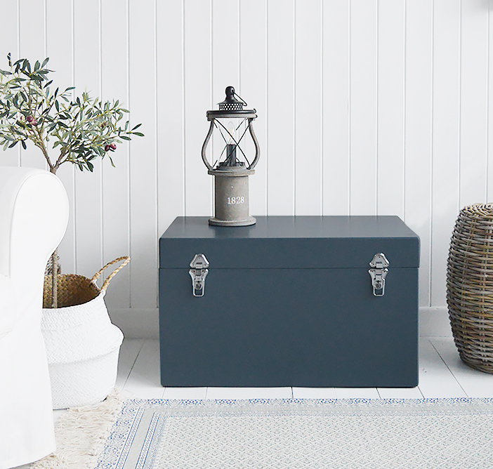 A set of two large different sized Newbury rectangle trunks in a luxurious dark blue grey colour in a matt finish with contrasting silver handles and clasps. The White Lighthouse New England Coastal and Country furniture and interiors. Bathroom, Living Room, Bedroom and Hallway Furniture for beautiful homes