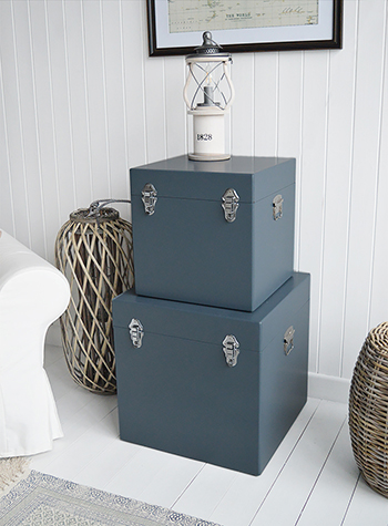 A set of two large different sized Newbury square trunks in a luxurious dark blue grey colour in a matt finish with contrasting silver handles and clasps. The White Lighthouse New England Coastal and Country furniture and interiors. Bathroom, Living Room, Bedroom and Hallway Furniture for beautiful homes