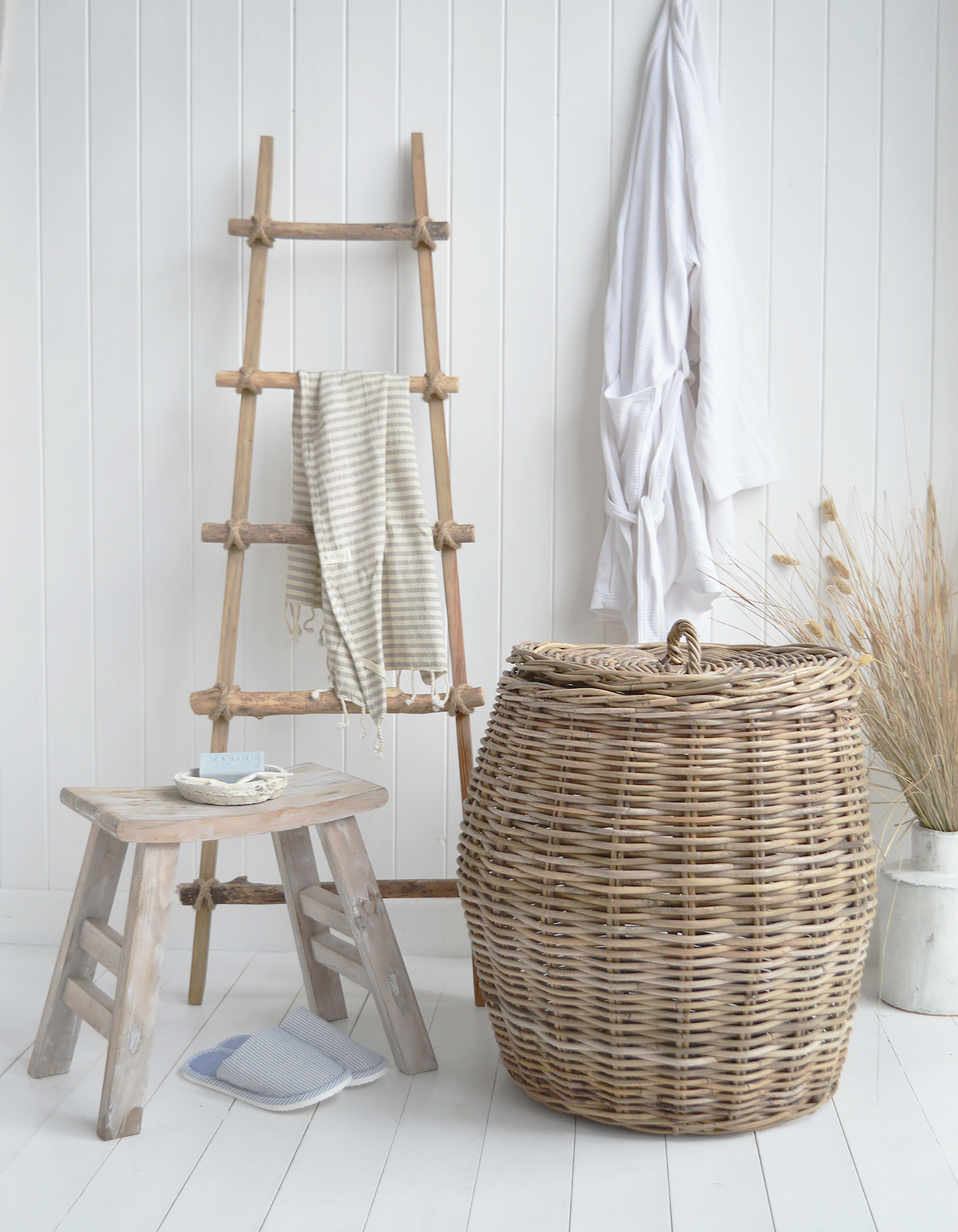 Give your bathroom a softer feel with woven storage, weathered wood and fresh white details