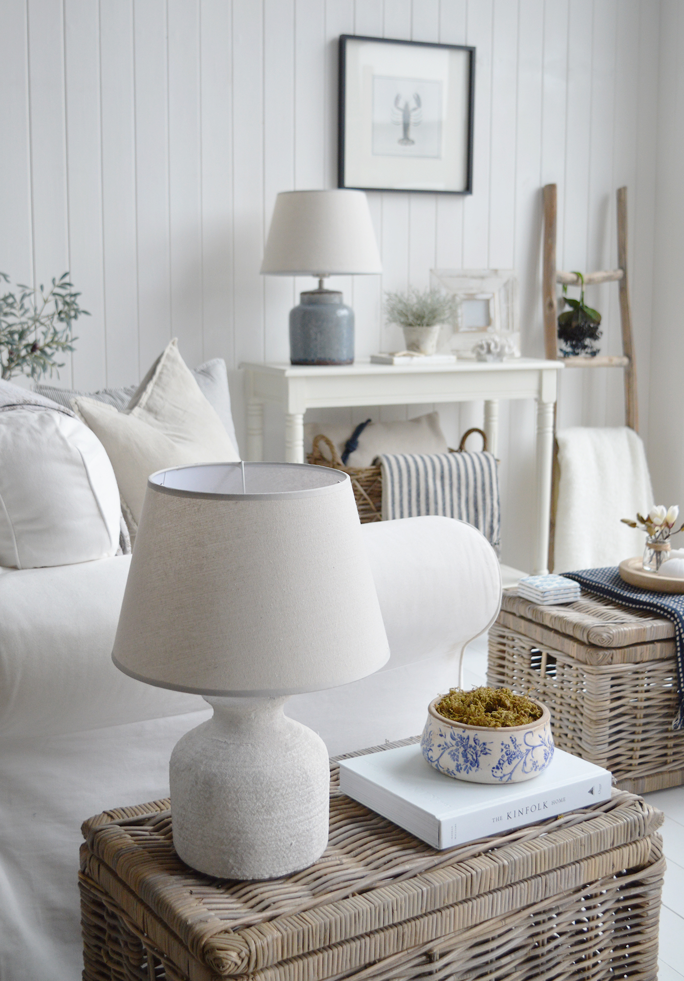 beach. house inspired living room with plenty of texture and warmth in traditional whites and blues and natural materiral