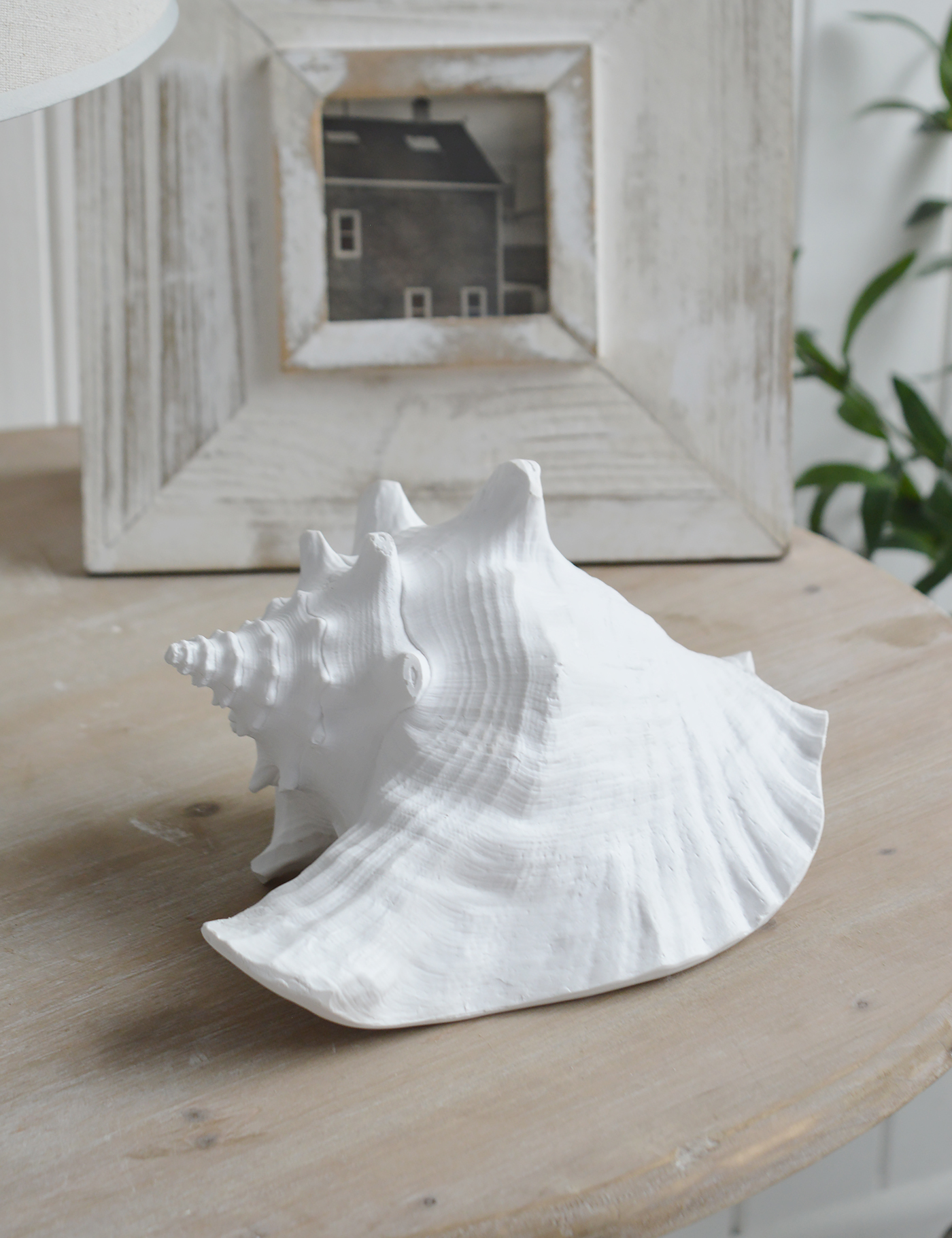 Resin White Conch Shell - Coffee Table Decor Elegant Coastal New England from The White Lighthouse Home. White Furniture and home decor accessories for the home interiors. New england and Hamptons interiors for luxury coastal home and beach house interiors