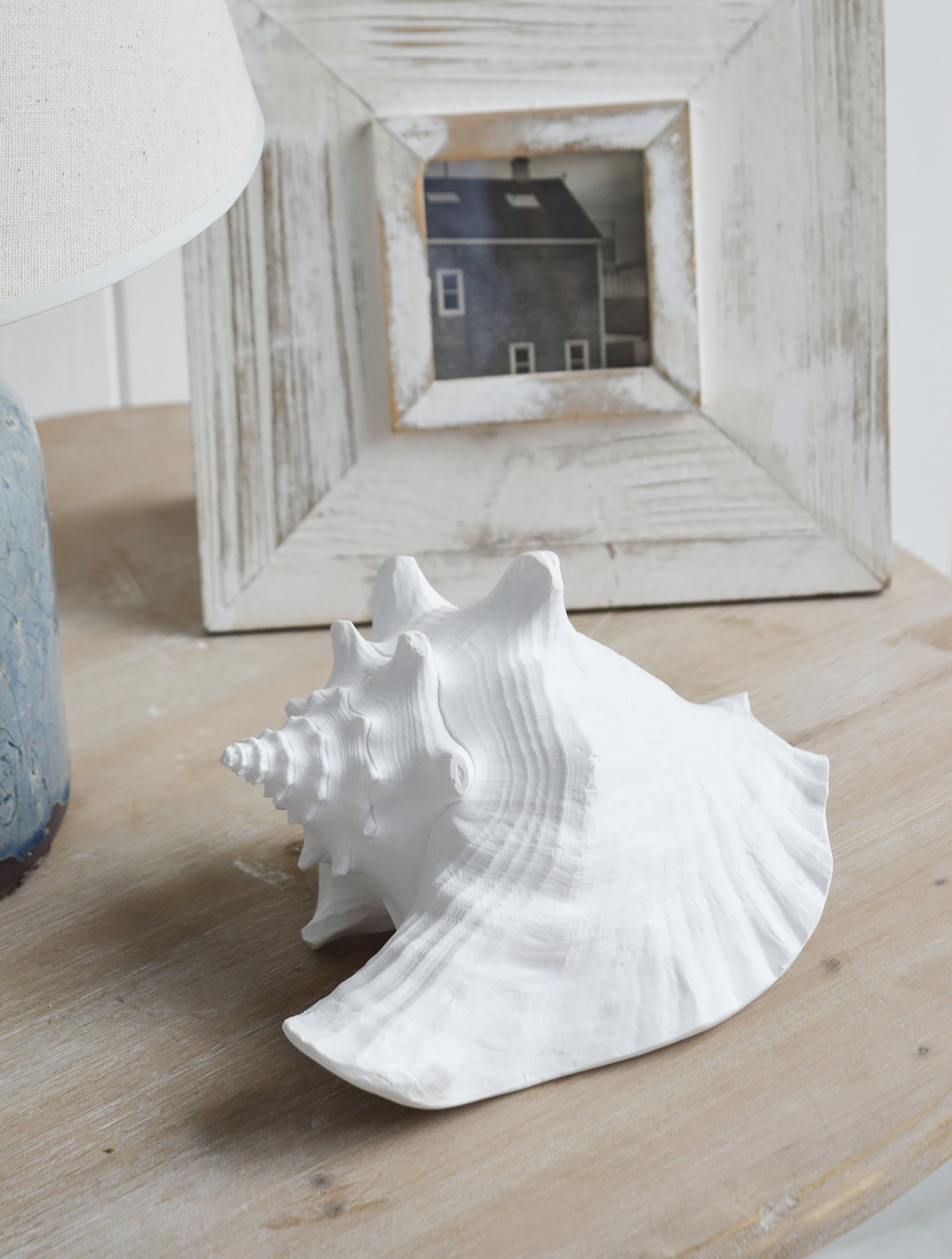 Resin White Conch Shell - Coffee Table Decor Elegant Coastal New England from The White Lighthouse Home. White Furniture and home decor accessories for the home interiors. New england and Hamptons interiors for luxury coastal home and beach house interiors