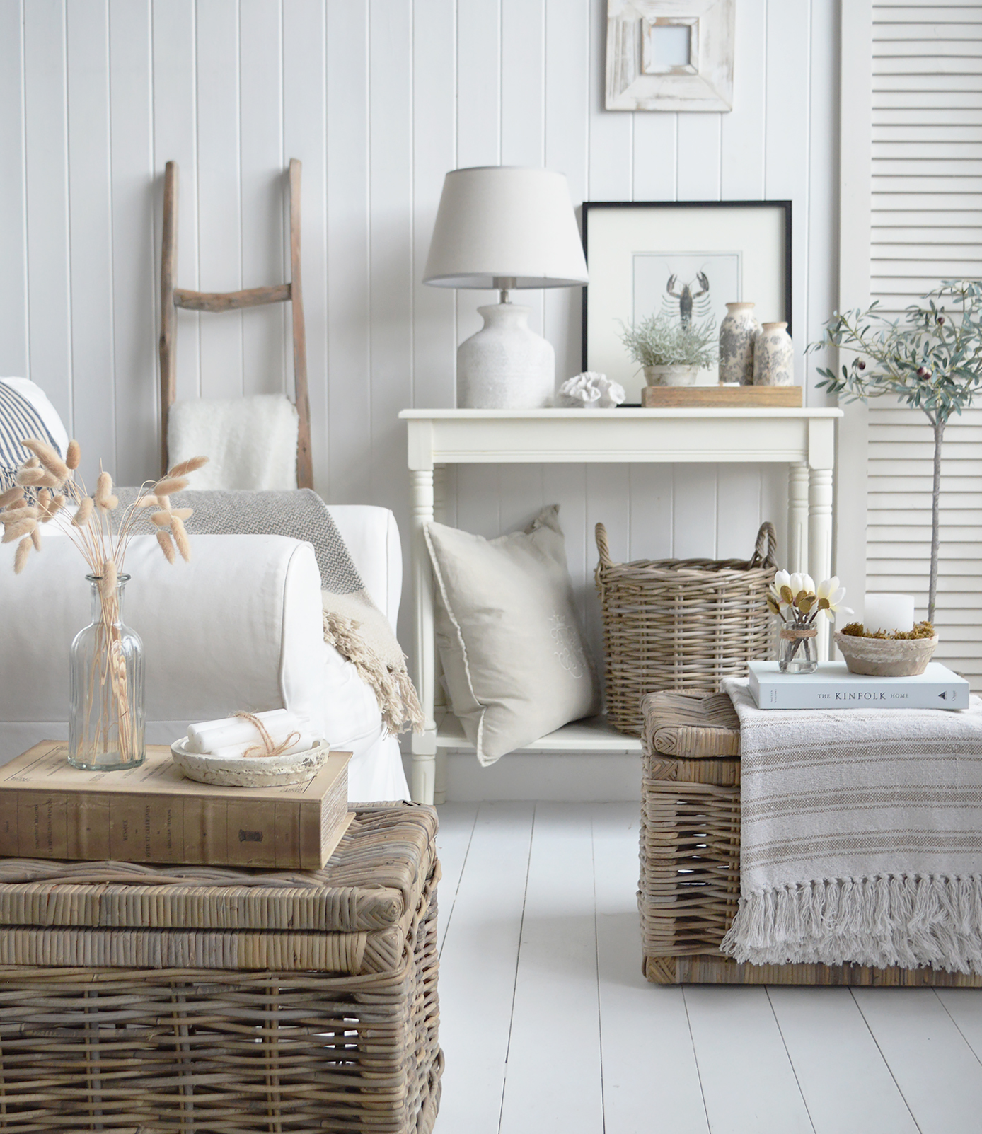 A coastally inspired living room with plenty of texture in baskets and white furniture