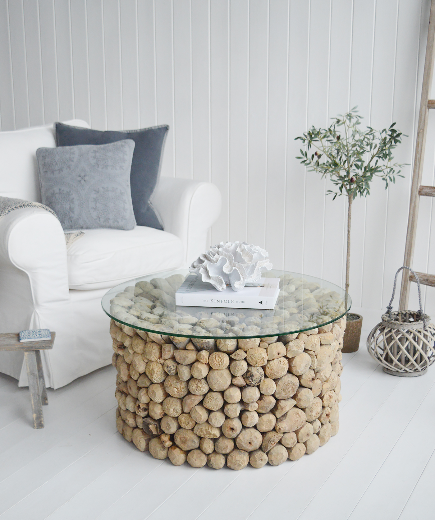 The Sag Harbor driftwood coffee table with a glass top, a stunning piece of coastal furniture for homes by the sea from The White Lighthouse for New England style interiors