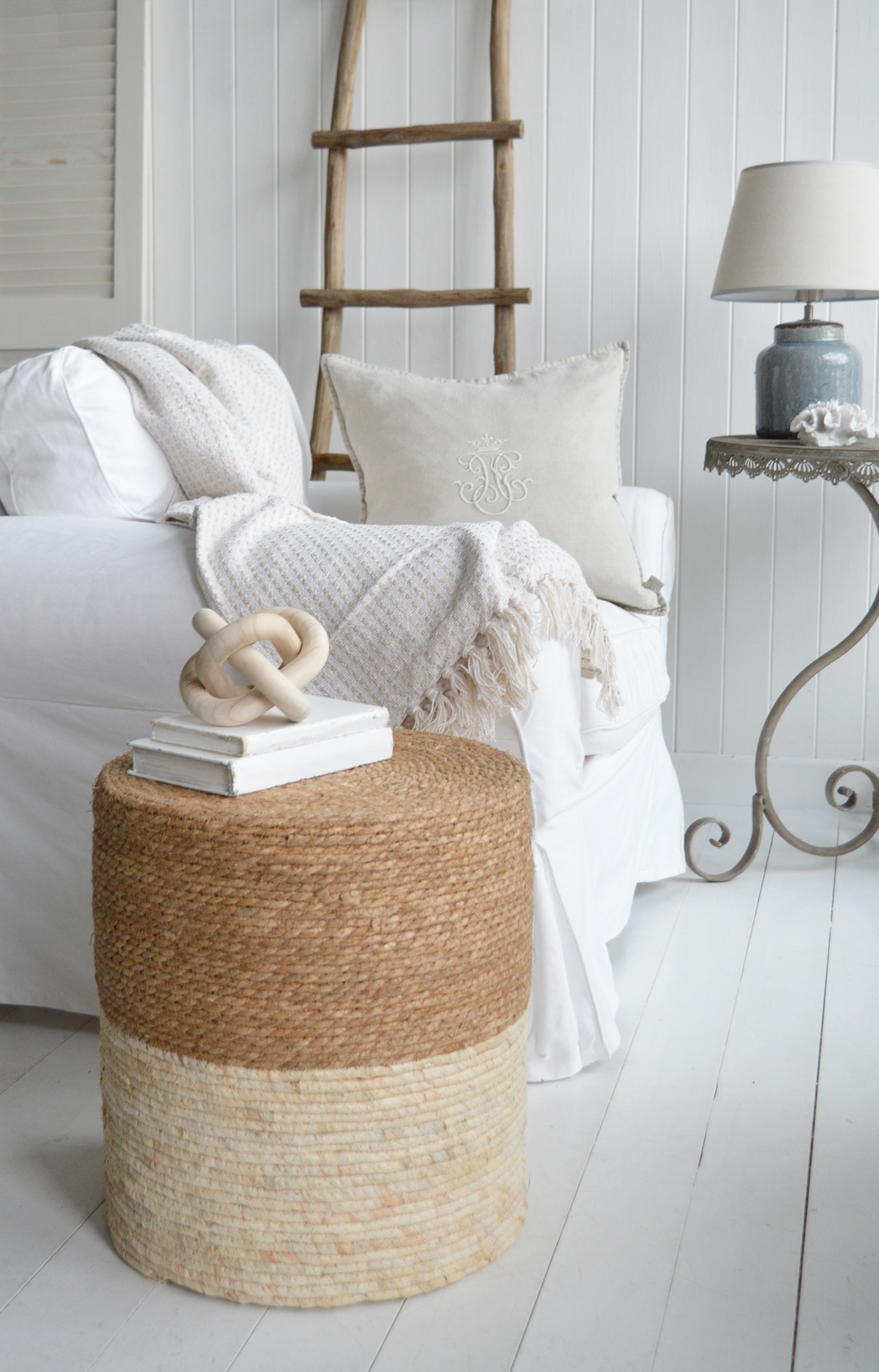 the textured stool to add a touch of cosiness into t coastally inspired home interior