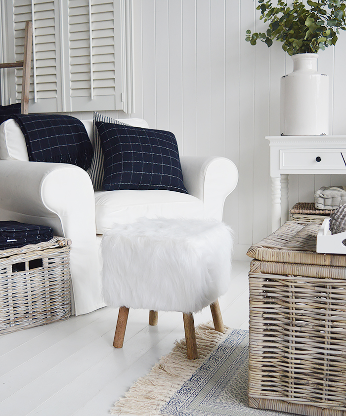 The Woodstock square white faux sheepskin fur stool with four contrasting legs in a rich coloured wood. Inspired by the laid back style of New England living in the country, by the coast and in the city, our beautiful Woodstock white foot stool adds warmth and texture to a room while offering extra seating and a comfortable place to rest your feet.