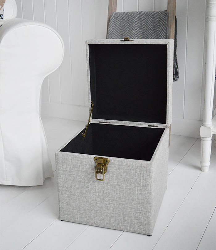The Kittery small large storage trunk in grey easy to clean fabric and robust antique brass clasps.  Ideal as a sturdy storage seat in the hall, blanket box in the bedroom or coffee table in the living room.  The padded top offers comfortable seating with plenty of storage inside.