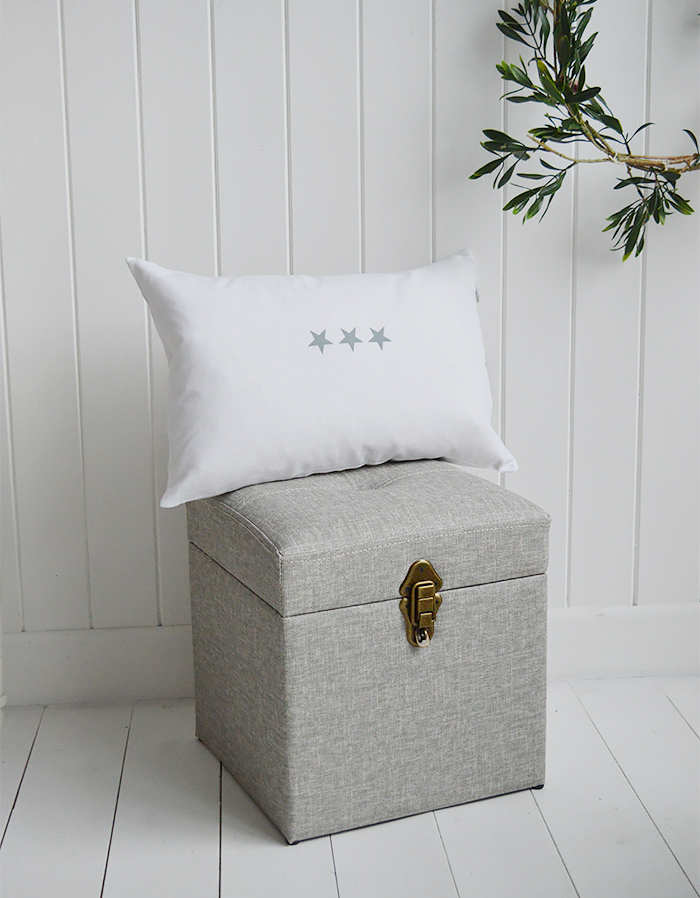 The Kittery small large storage trunk in grey easy to clean fabric and robust antique brass clasps.  Ideal as a sturdy storage seat in the hall, blanket box in the bedroom or coffee table in the living room.  The padded top offers comfortable seating with plenty of storage inside.