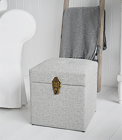 The Kittery small large storage trunk in grey easy to clean fabric and robust antique brass clasps.  Ideal as a sturdy storage seat in the hall, blanket box in the bedroom or coffee table in the living room.  The padded top offers comfortable seating with plenty of storage inside.