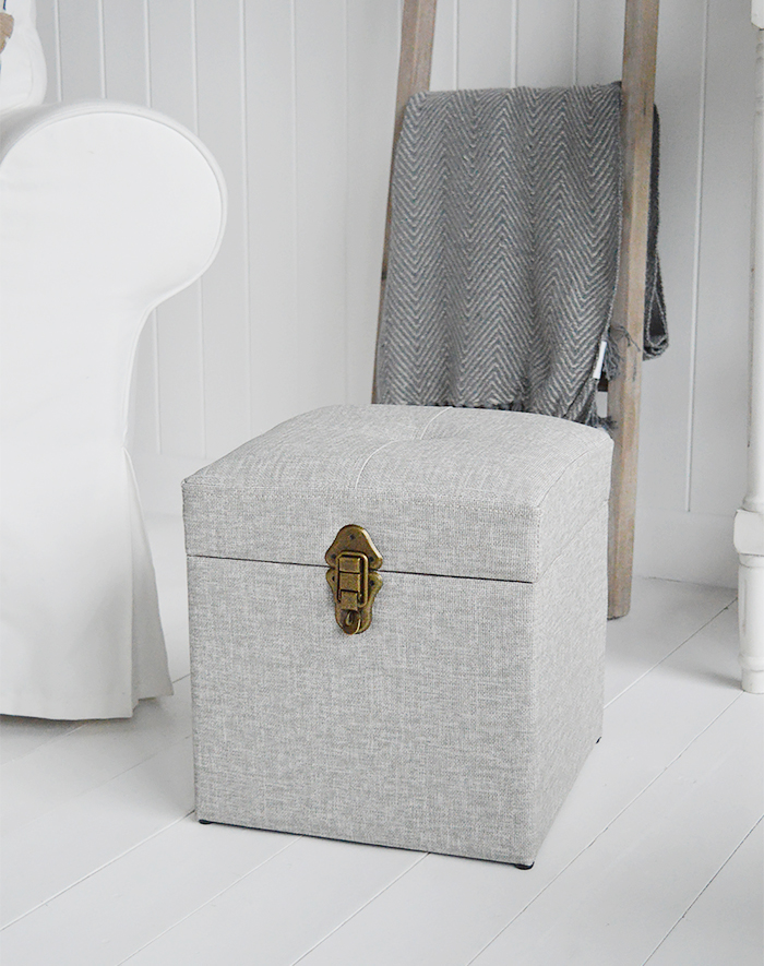 The Kittery small large storage trunk in grey easy to clean fabric and robust antique brass clasps.  Ideal as a sturdy storage seat in the hall, blanket box in the bedroom or coffee table in the living room.  The padded top offers comfortable seating with plenty of storage inside.