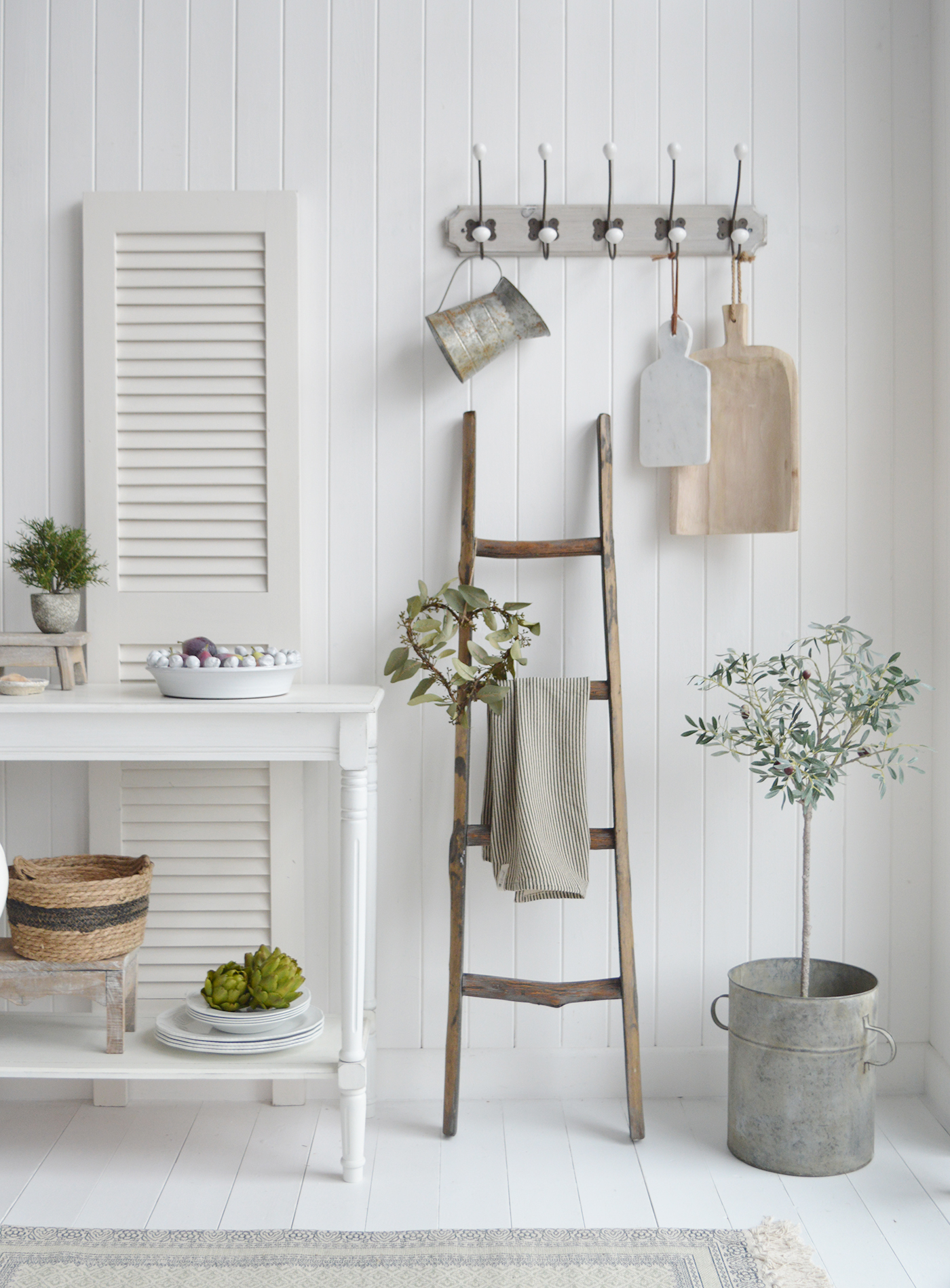 The driftwood ladder in a kitchen as a teal toel holder for Modern Farmhouse kitchens New England style