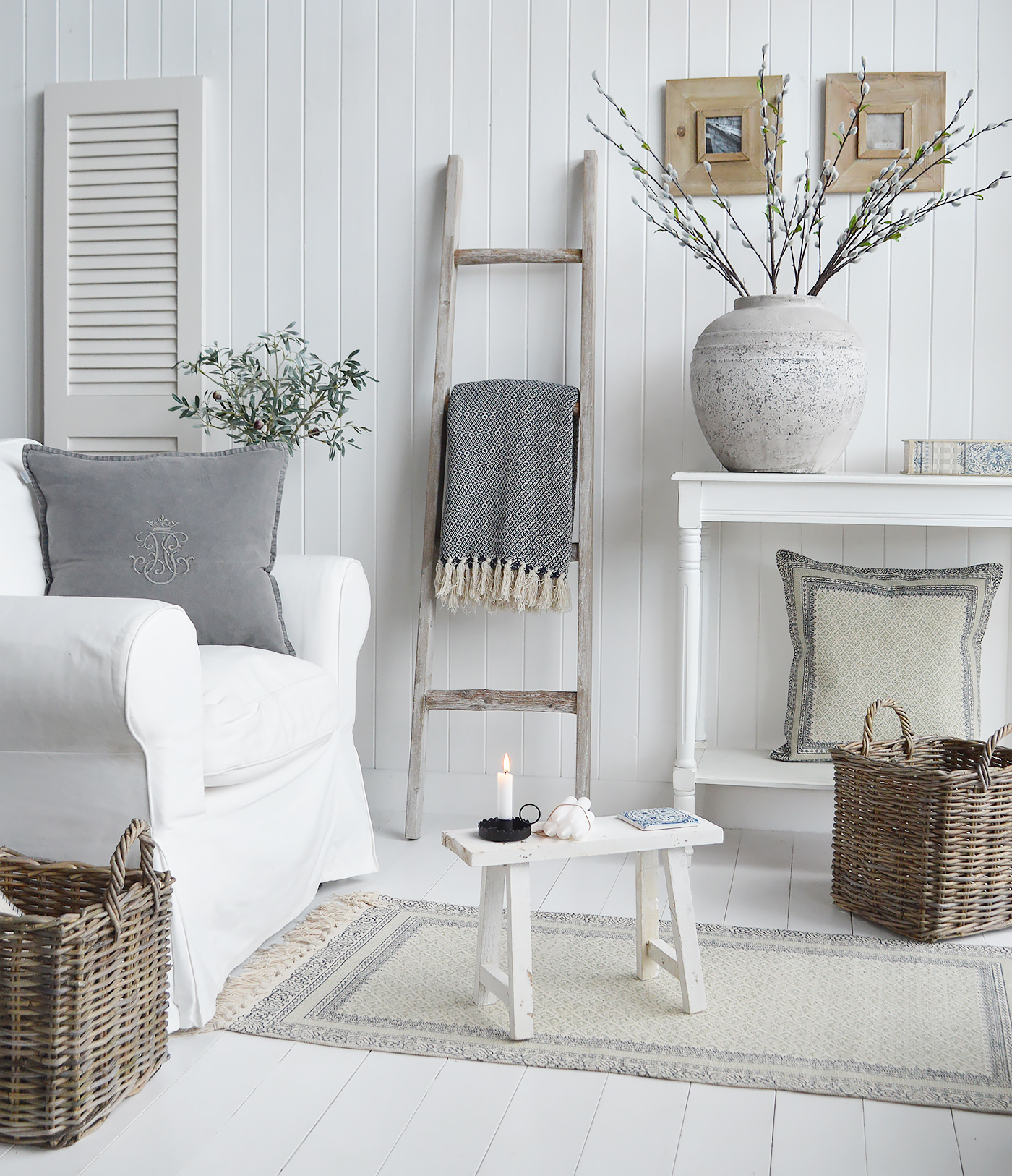 Wooden Driftwood ladder in a white living room withthe rustic Pawtucket decorastive stool for New England country, coastal and modern farmhouse furniture and home interiors