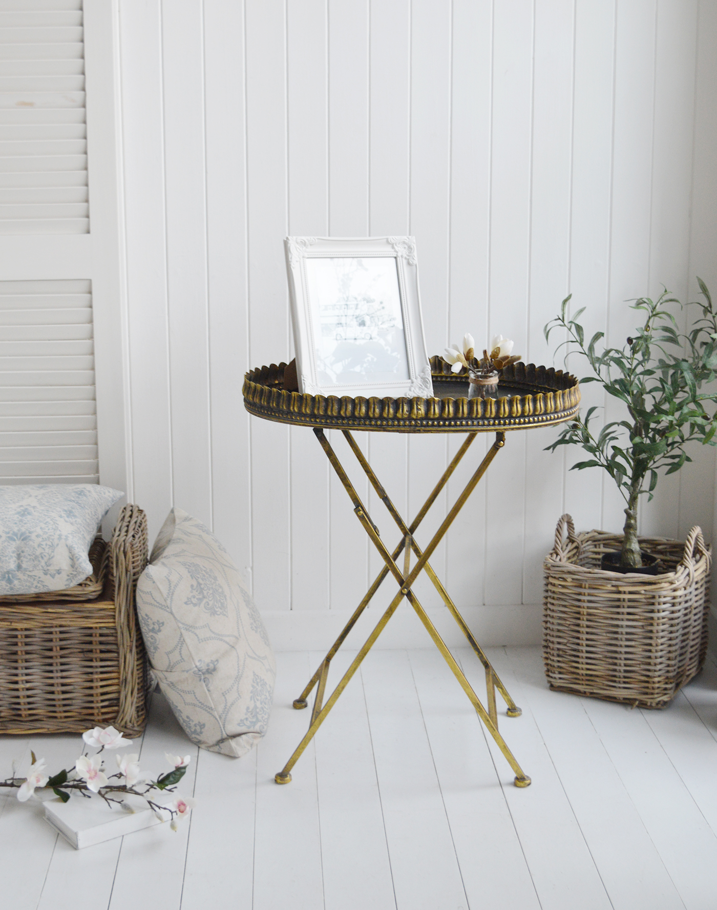 Mystic folding metal table with orante detailing, a perfect Hamptons piece of coaastal furniture
