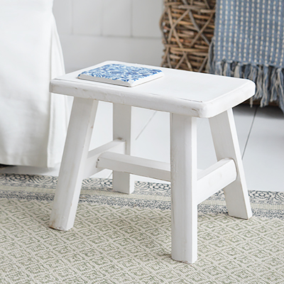 rustic handmade Nantucket white milking stool made from reclaimed wood. A versatile piece for furniture for coastal and country interior designs