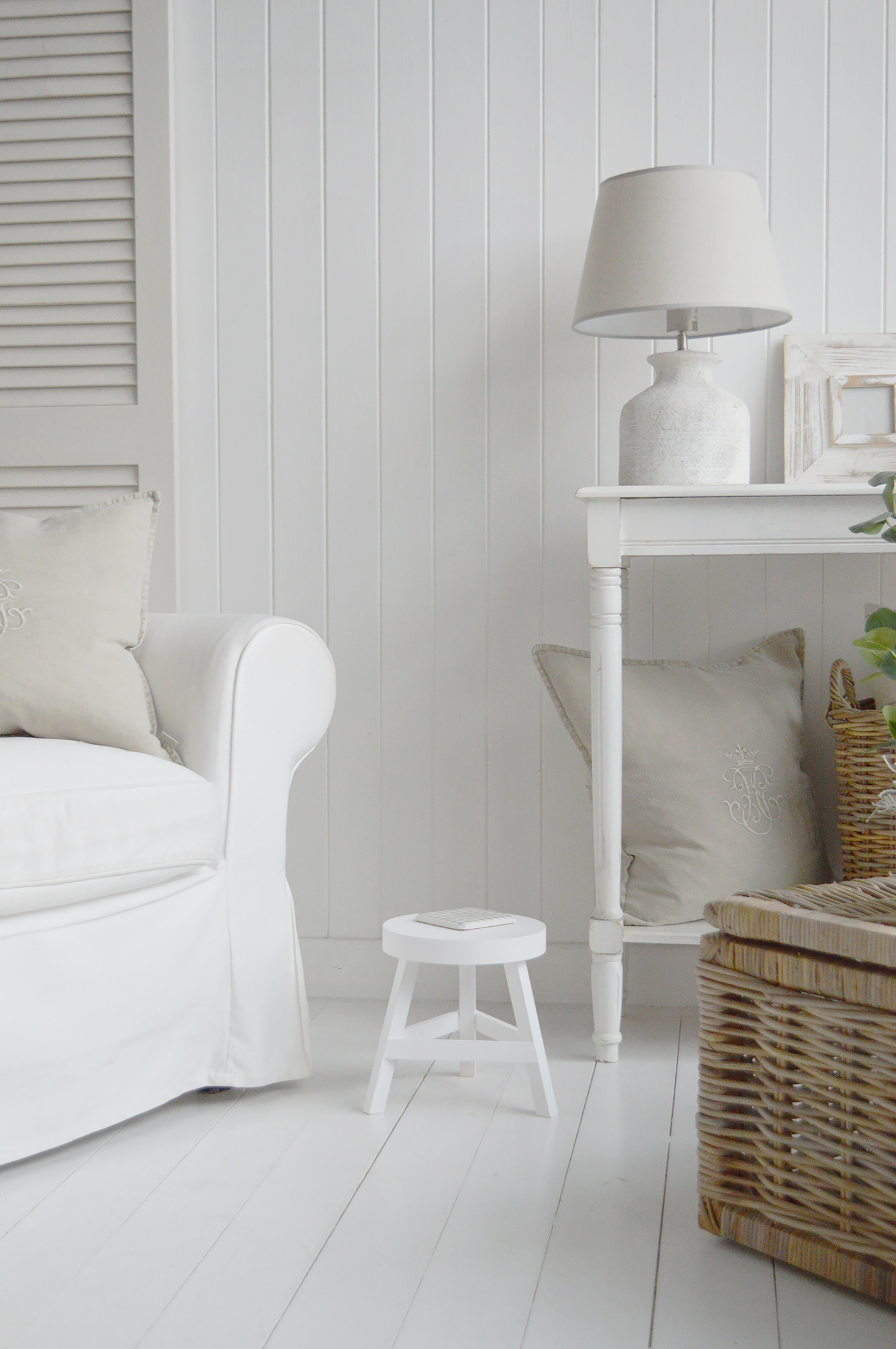 A white living room with the Nantucket milking stool for New England coastal and country furniture
