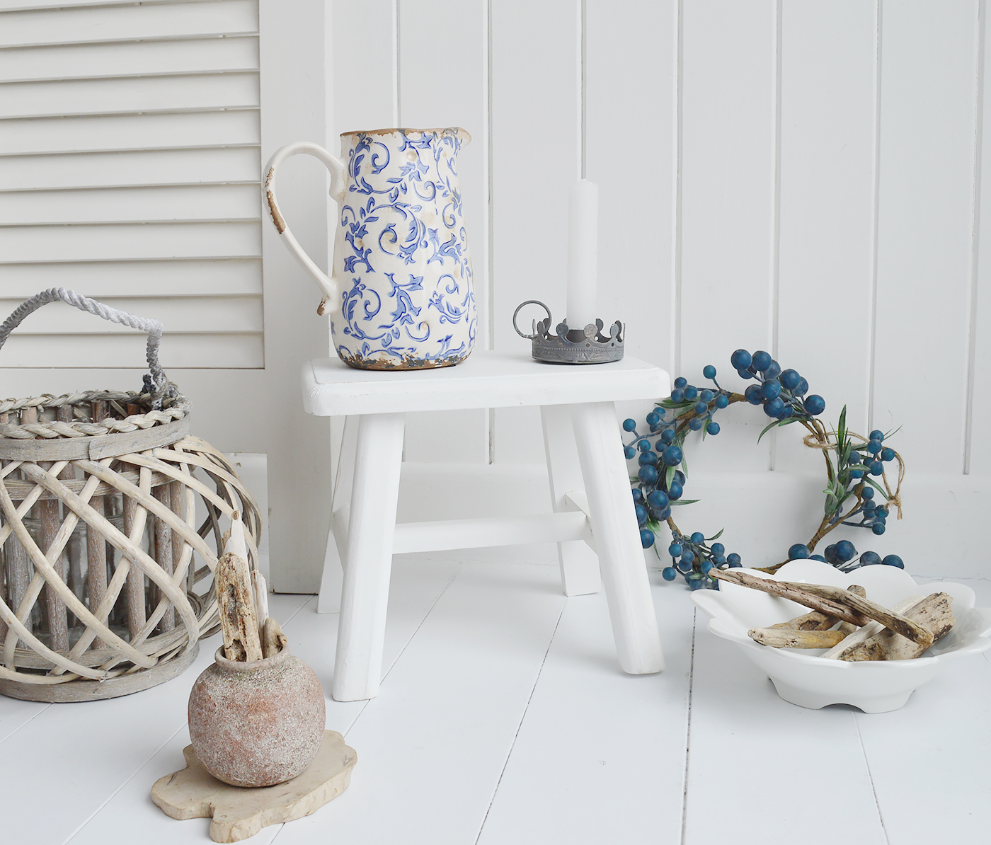 rustic handmade Nantucket white milking stool made from reclaimed wood. A versatile piece for furniture for coastal and country interior designs