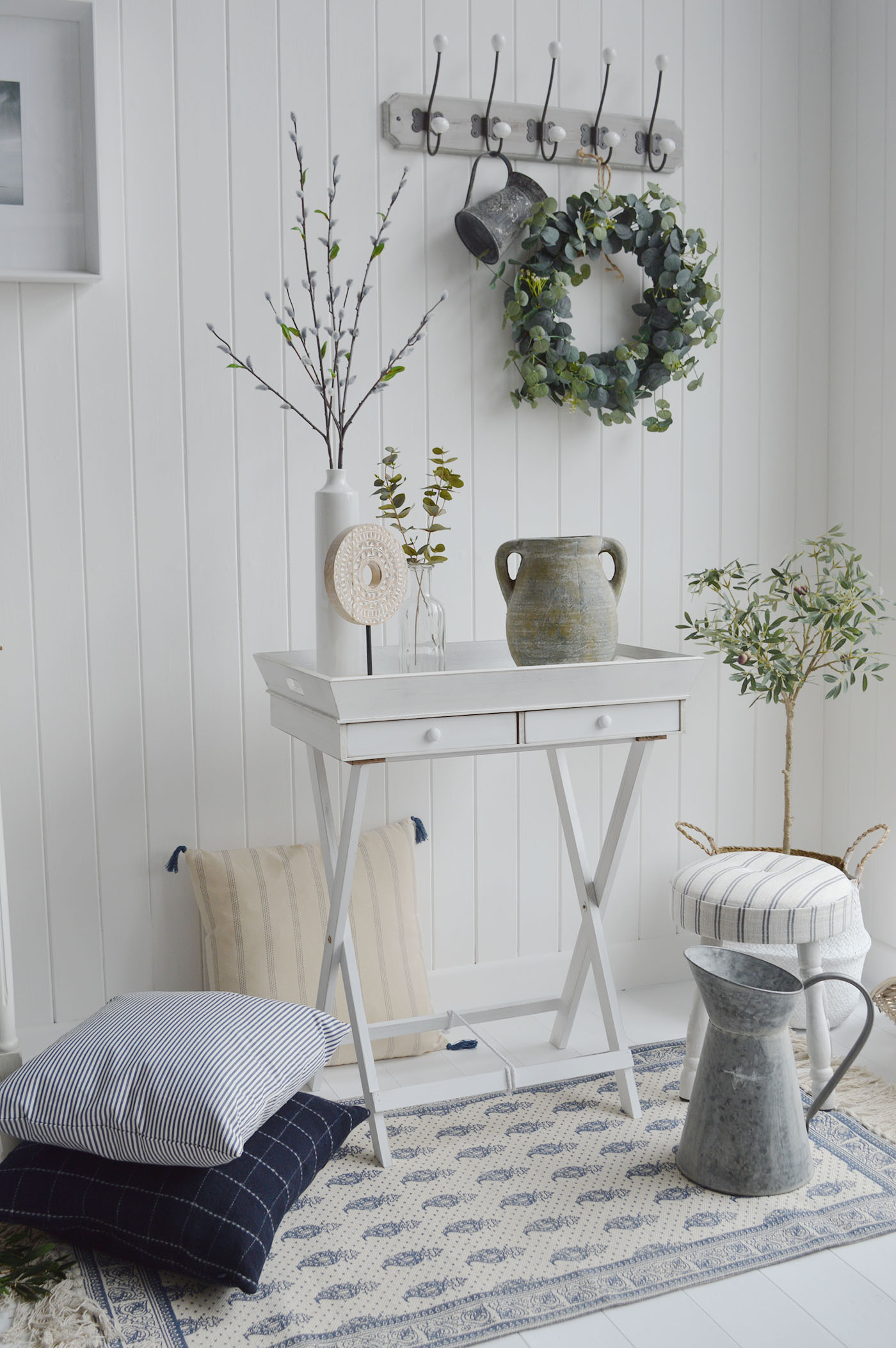 Our large rustic white Rhode Island white butlers table with drawers.    Named after the New England state of Rhode Island, the table has a white rustic finish and is designed to have the simple laid back appeal that is famous of our interior New England style.    Ideal as a lamp table in the living room, bedside in the bedroom or a small hall table. The large tray is removable to allow easy storage if required. Perfectly complements all country, coastal and city homes.