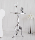 Polished metal table with white top