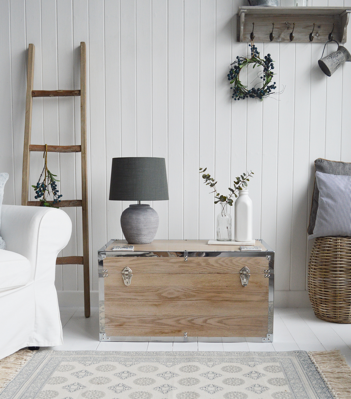 Vermont white washed storage trunks from The White Lighthouse. New England style furniture for coastal, country, farmhouse, cottage and city homes and interiors. Living Room, hallway and bedroom storage furniture