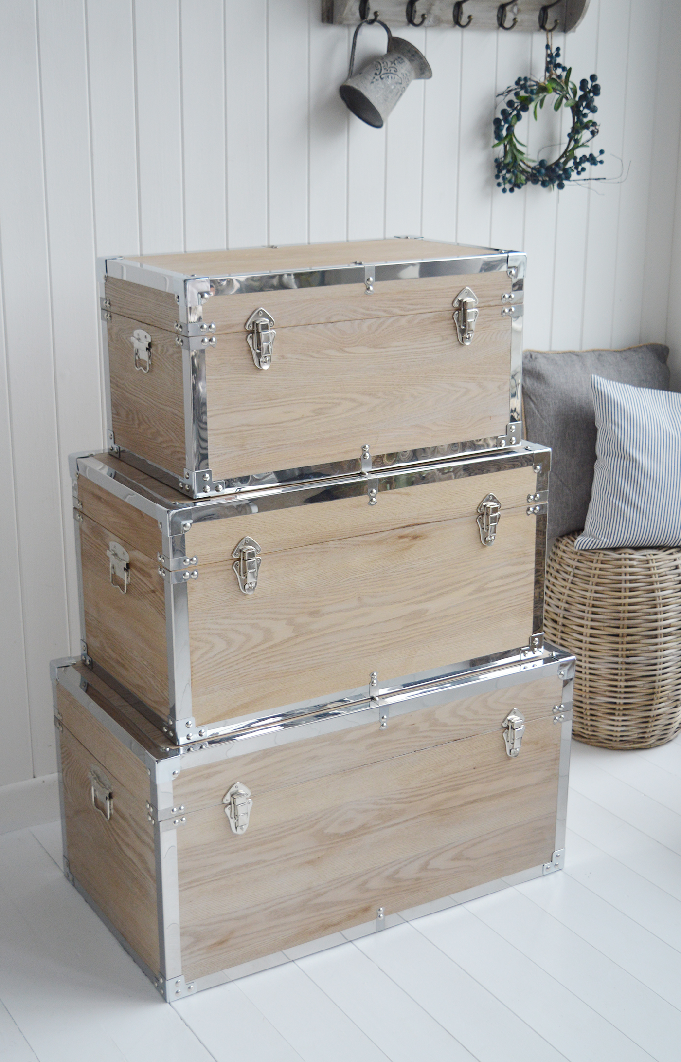 Vermont white washed storage trunks from The White Lighthouse. New England style furniture for coastal, country, farmhouse, cottage and city homes and interiors. Living Room, hallway and bedroom storage furniture