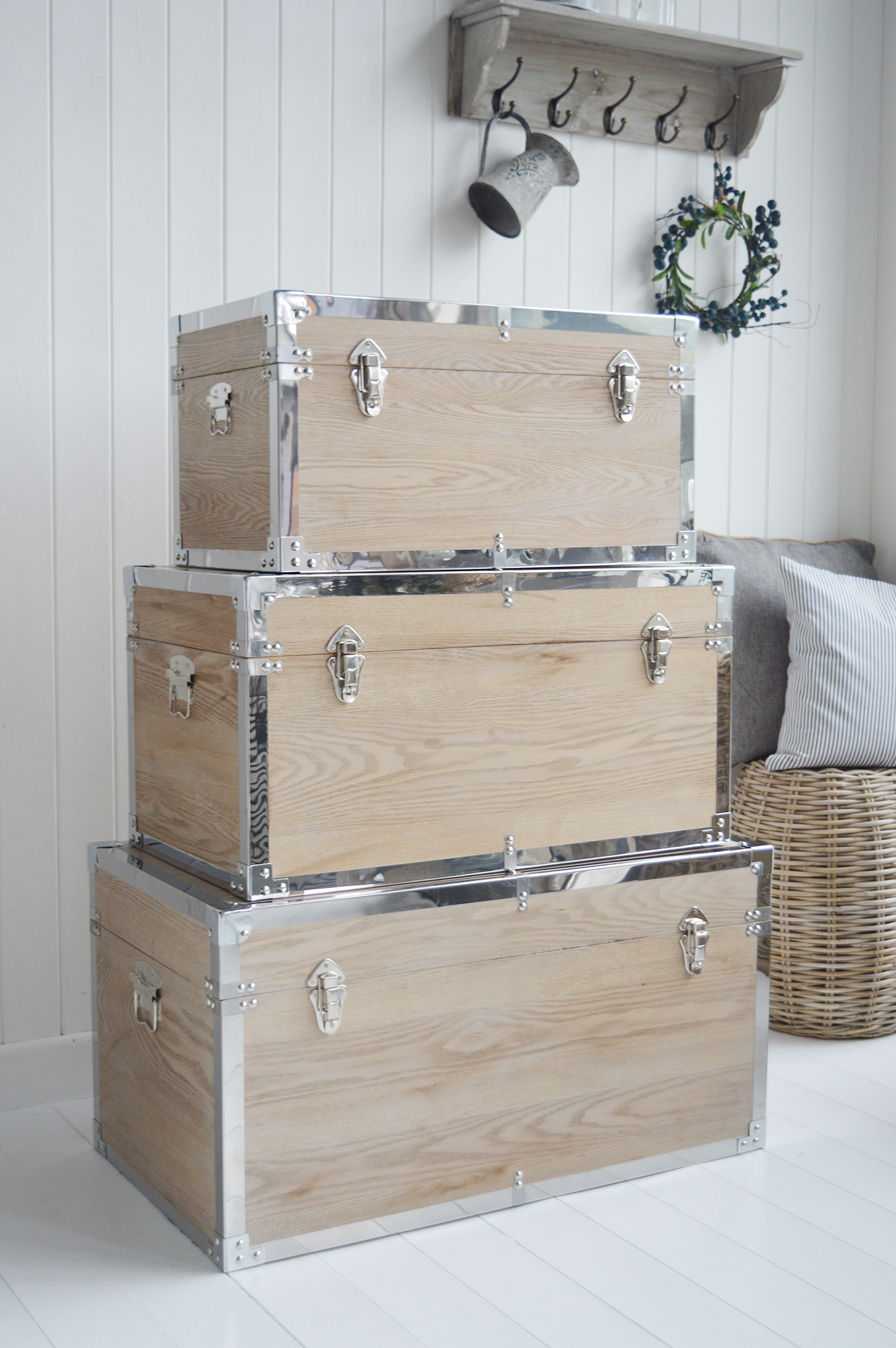 Vermont white washed storage trunks from The White Lighthouse. New England style furniture for coastal, country, farmhouse, cottage and city homes and interiors. Living Room, hallway and bedroom storage furniture