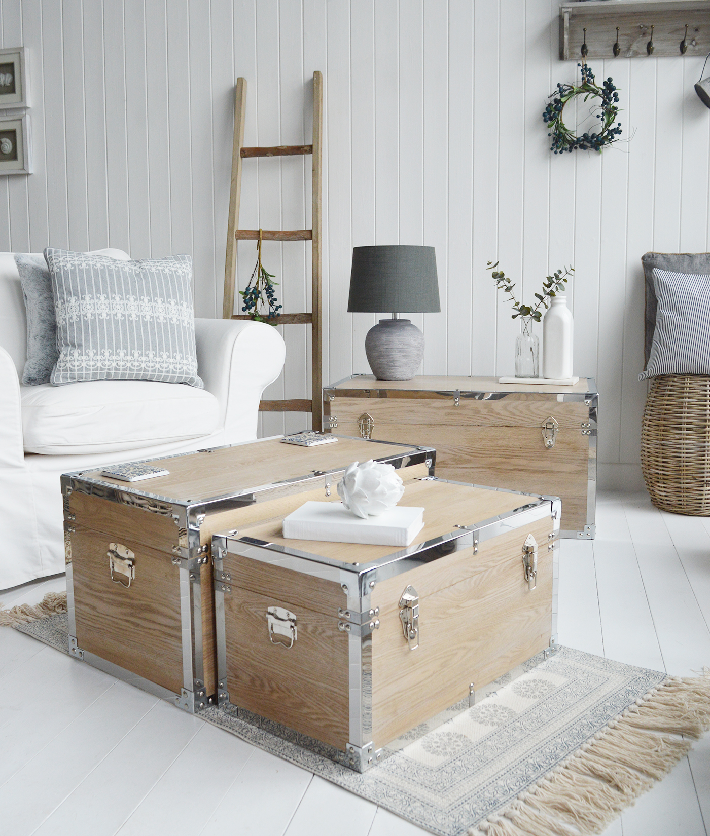 Vermont white washed storage trunks from The White Lighthouse. New England style furniture for coastal, country, farmhouse, cottage and city homes and interiors. Living Room, hallway and bedroom storage furniture