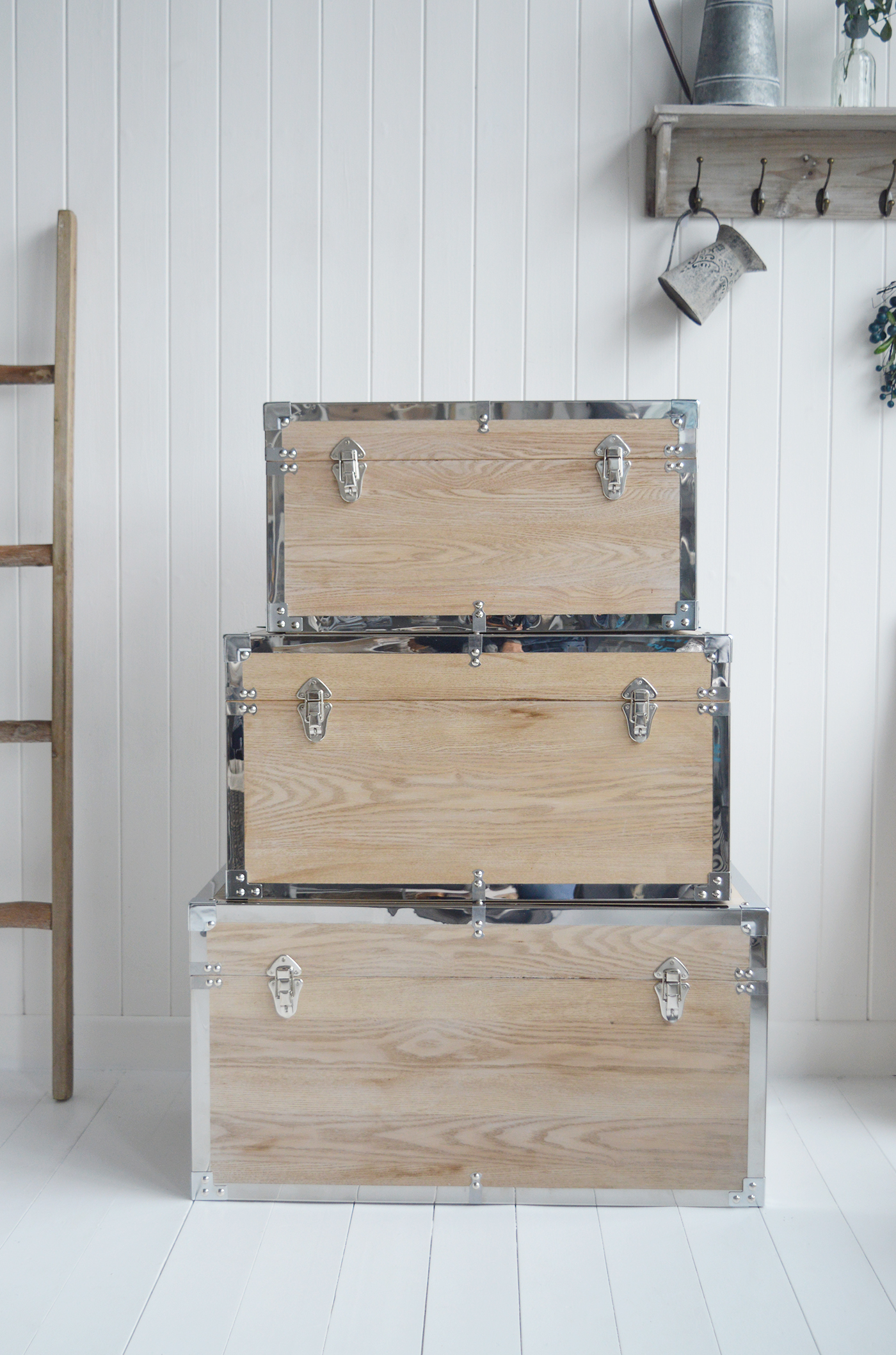 Vermont white washed storage trunks from The White Lighthouse. New England style furniture for coastal, country, farmhouse, cottage and city homes and interiors. Living Room, hallway and bedroom storage furniture