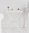 White butler tray table for halls. The tray table makes an excellent small console or lamp table when space is at a minimum