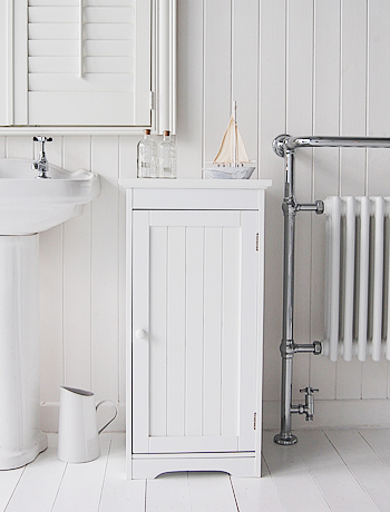 A white bathroom storage cabinet