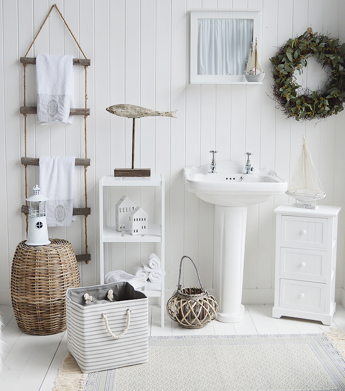 White Bathroom furniture in a coastal inspired bathroom. Shoes the storage furniture including Maine white cabinet , rope ladder for towels and the Brighton 3 tier shelves