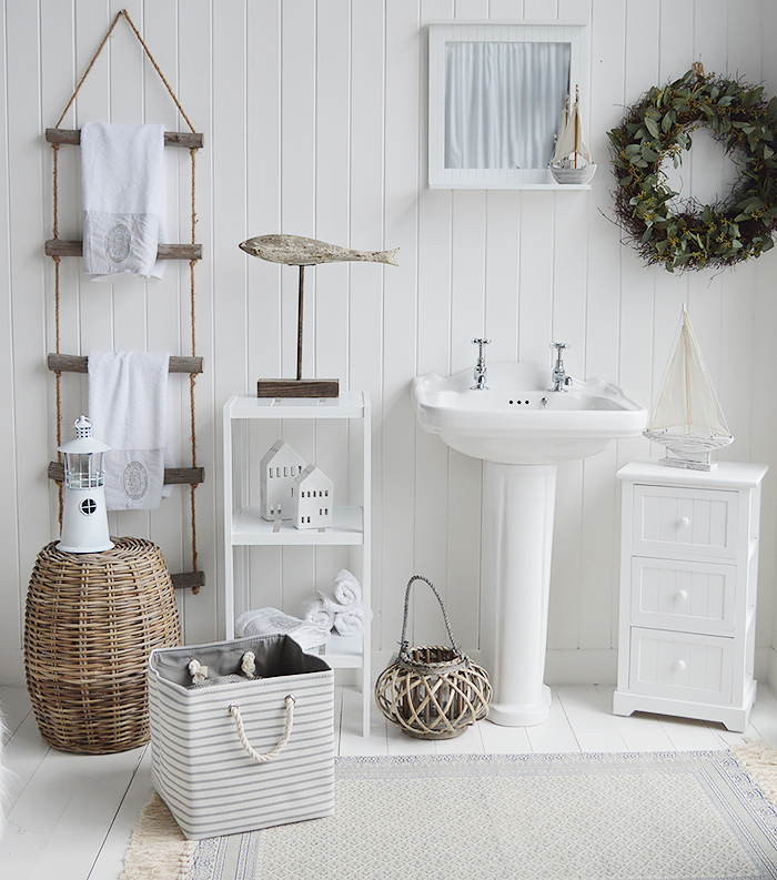 White coastal bathroom decor. FUrniture and accessories for a New England look