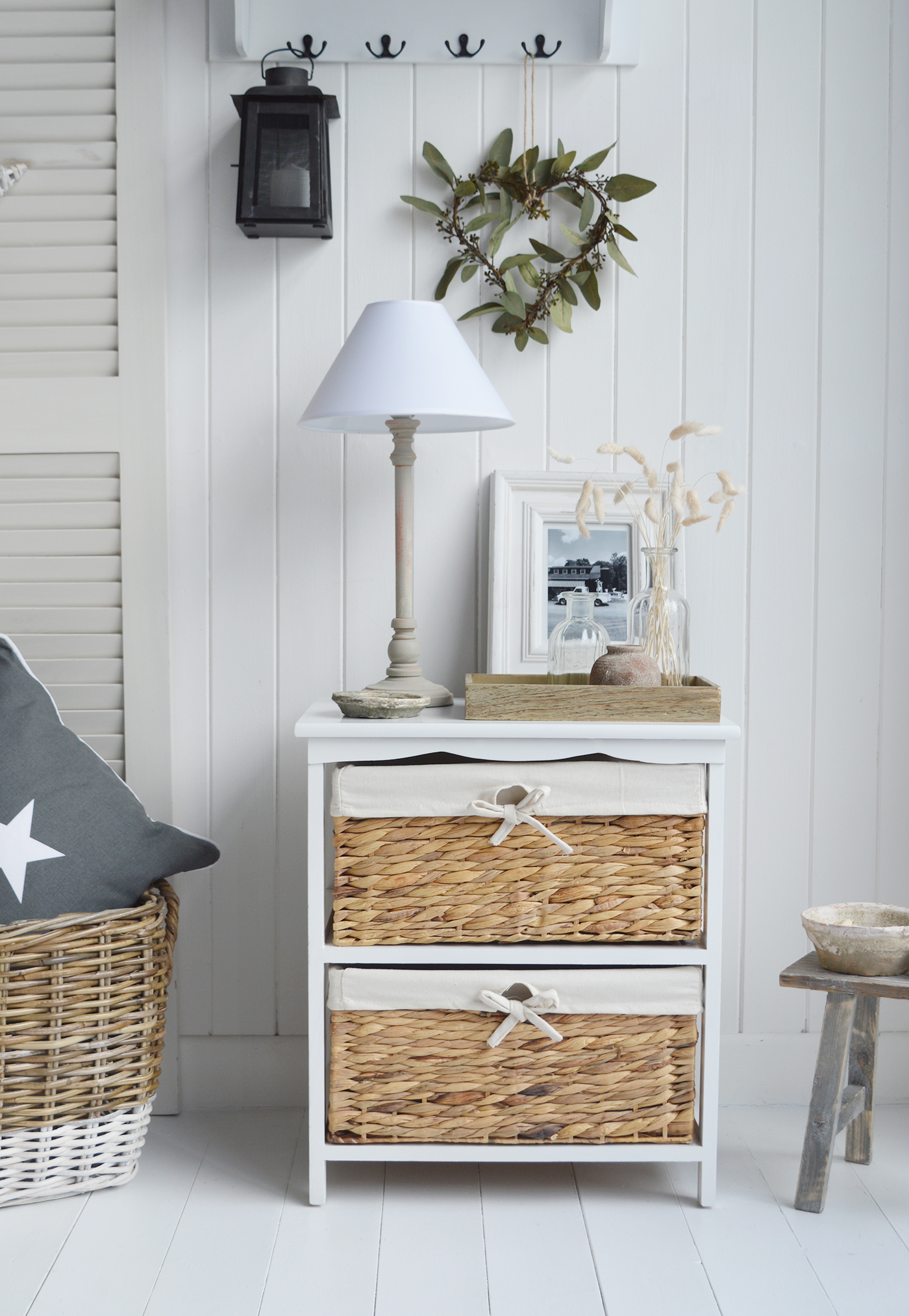 The White Lighthouse bedroom furniture. A wide white bedside table with two basket drawers for New England Country, coastal, modern farmhouse furniture and interiors, can be used as a white lamp table from The Bar Harbor range