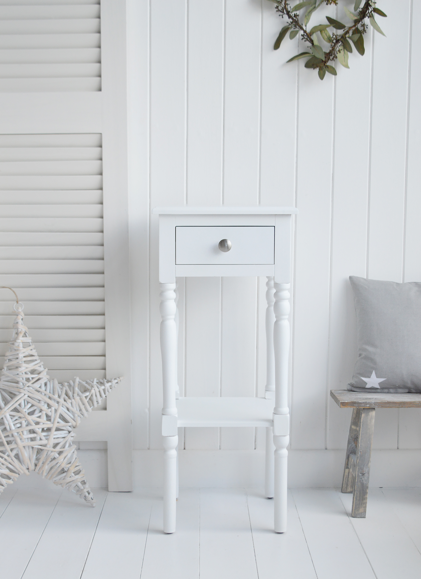 The White Lighthouse bedroom furniture. A narrow white bedside table with drawer and silver handle, can be used as a white lamp table from The Georgetown range