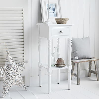 The White Lighthouse bedroom furniture. A narrow white bedside table with drawer and silver handle, can be used as a white lamp table from The Georgetown range