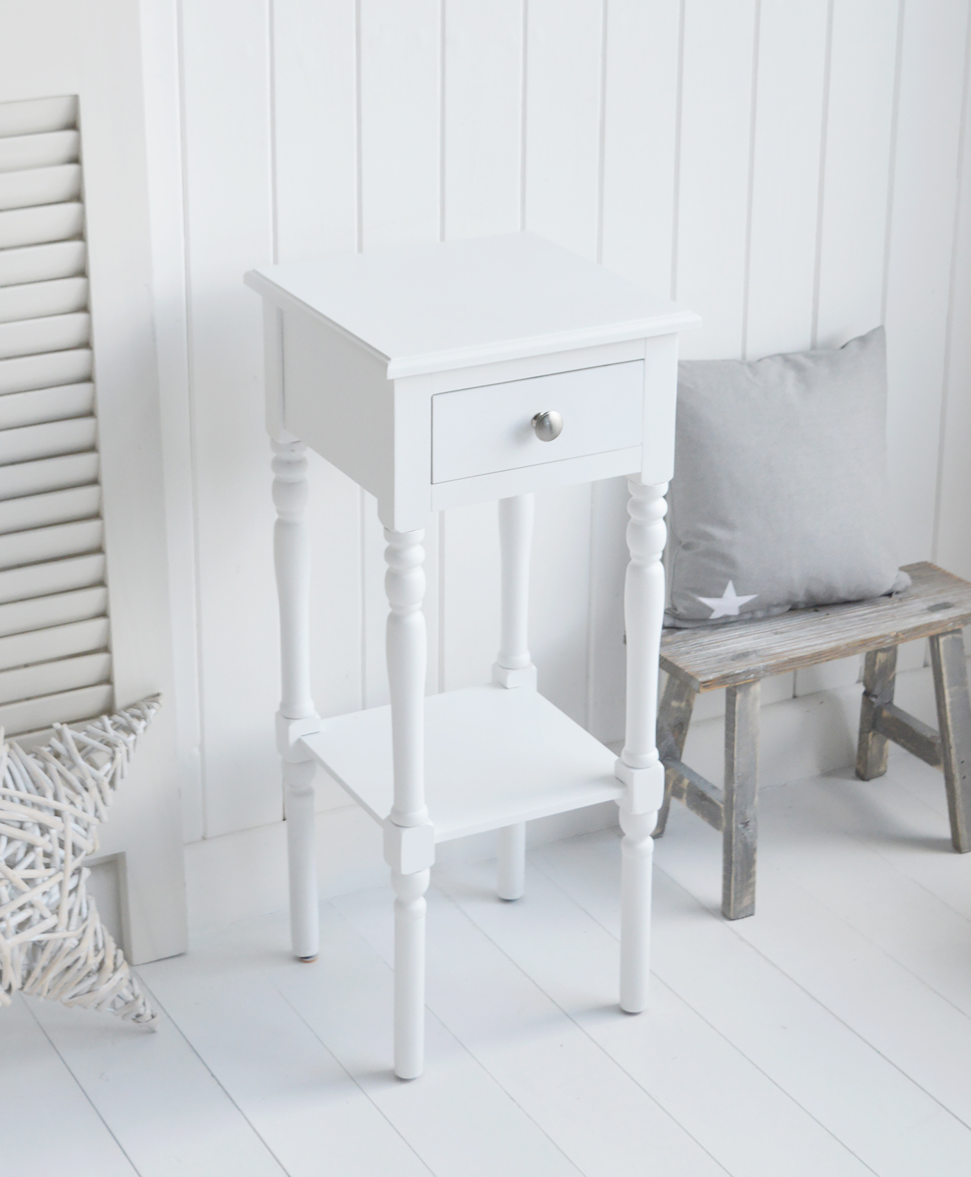 The White Lighthouse bedroom furniture. A narrow white bedside table with drawer and silver handle, can be used as a white lamp table from The Georgetown range
