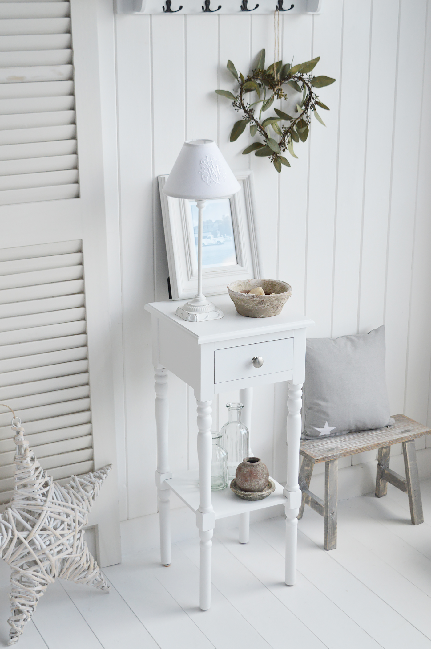 The White Lighthouse bedroom furniture. A narrow white bedside table with drawer and silver handle, can be used as a white lamp table from The Georgetown range