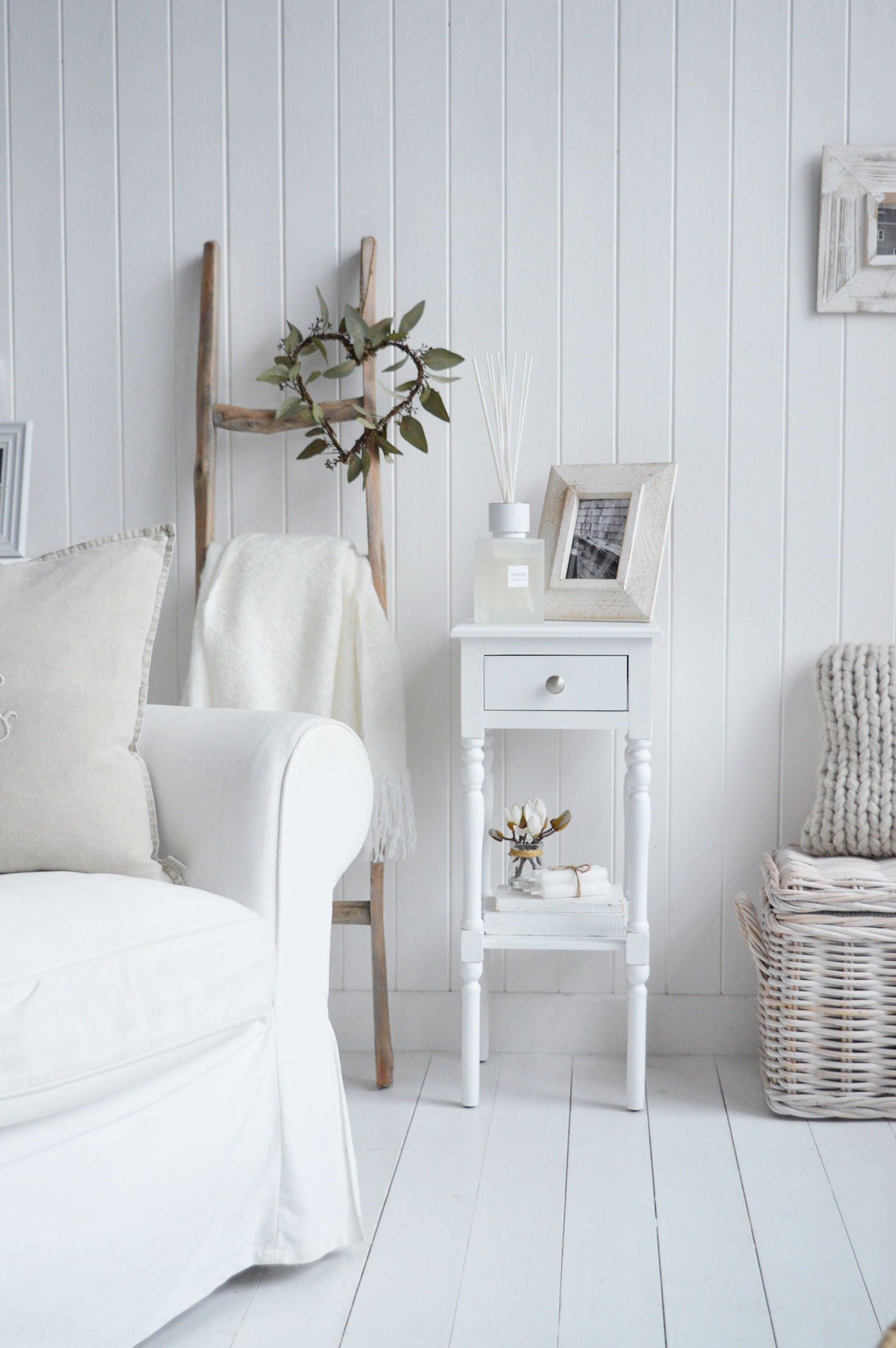 The Georgetown white narrow bedside table with a drawer and shelf in a white interior
