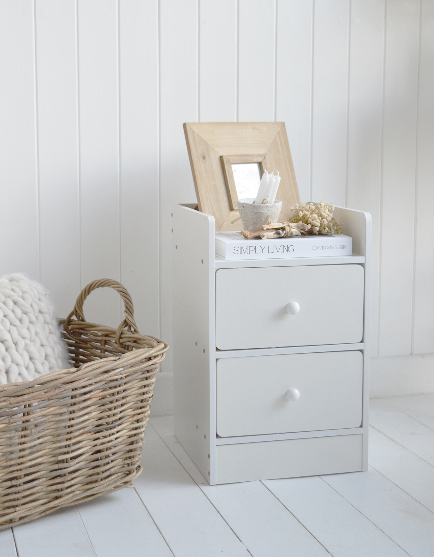 Designed for calm and elegant spaces, the Lindford bedside table complements white wooden floors and soft layered bedding.