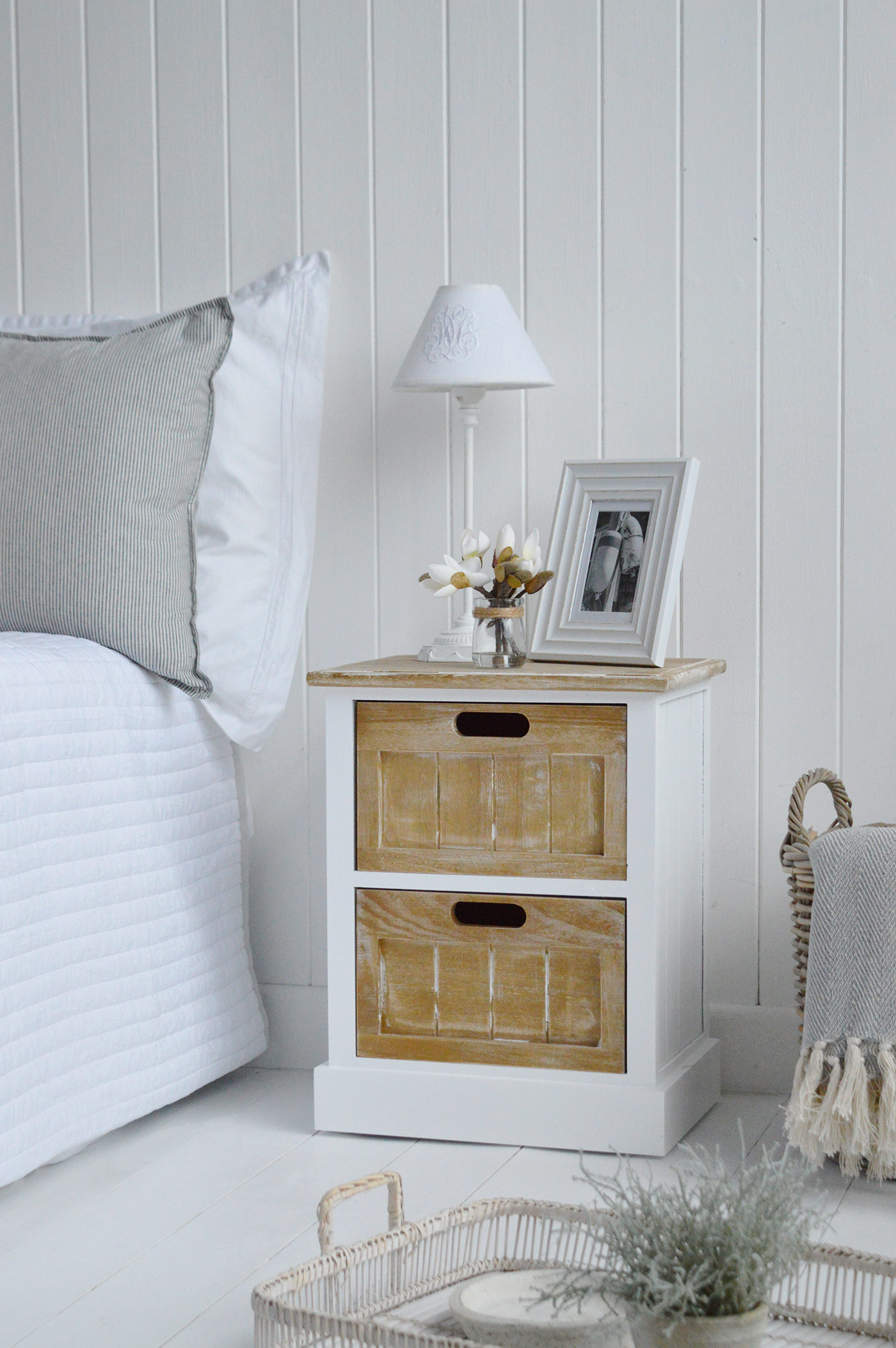 The Maine white bedside cabinet with two drawers for a coastal inspired bedroom