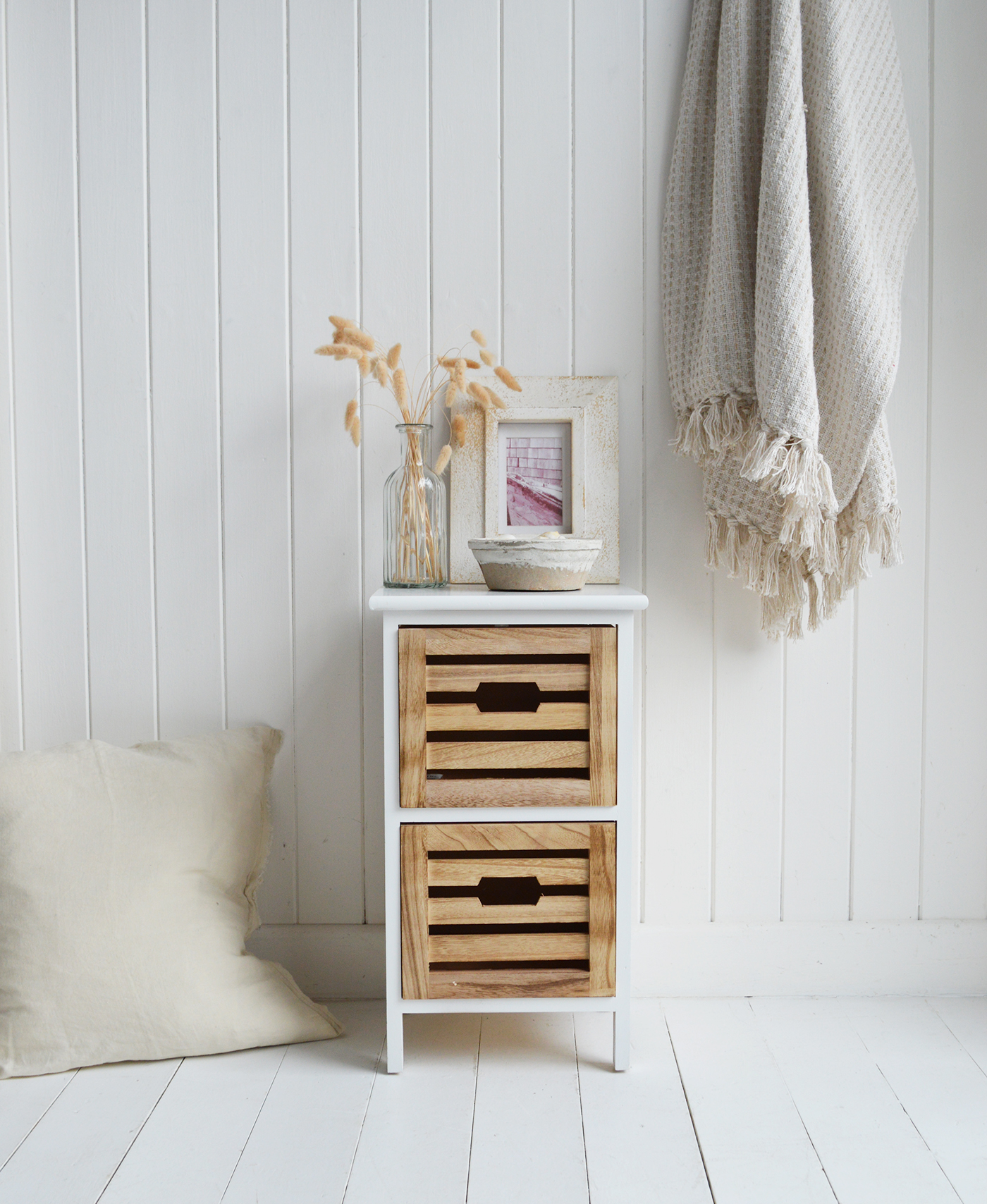 Northport Slim narrow bedside table with white frame and two natural wood slatted drawers in coastal style bedroom