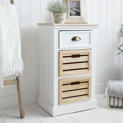 The Southport White Cabinet with three drawers - A Bedside or Lamp Table for Modern Country, Farmhouse and Coastal Furniture. The calming tones of the white washed wood of the drawers and top, against the white body lend to a light and airy feel to your space