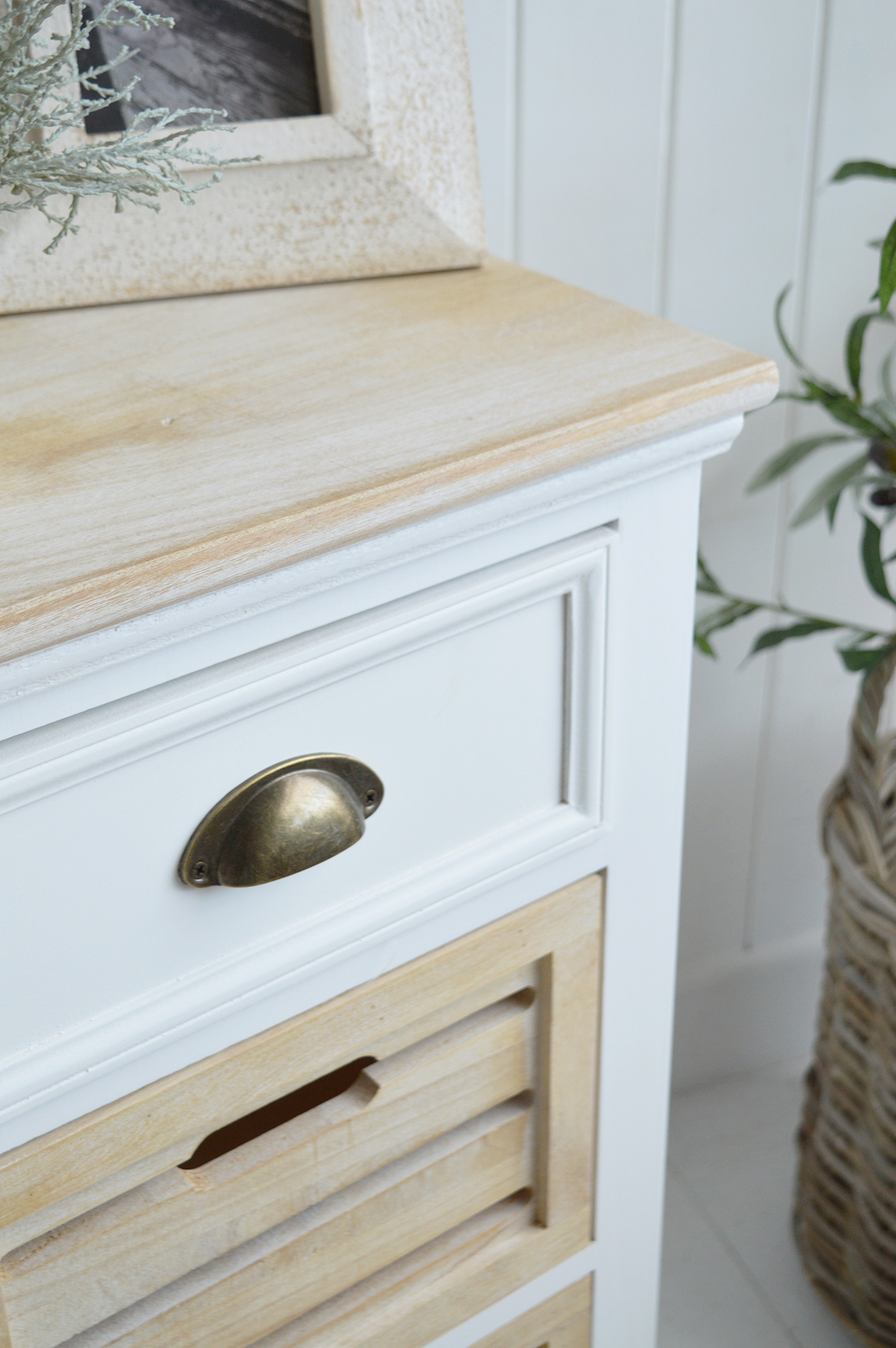 The Southport White Cabinet with three drawers - A Bedside or Lamp Table for Modern Country, Farmhouse and Coastal Furniture. The calming tones of the white washed wood of the drawers and top, against the white body lend to a light and airy feel to your space