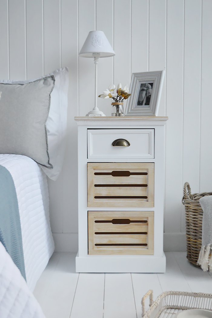 The Southport white bedside table with three drawers in a traditional clapboard finish for a modern coastal feel interior