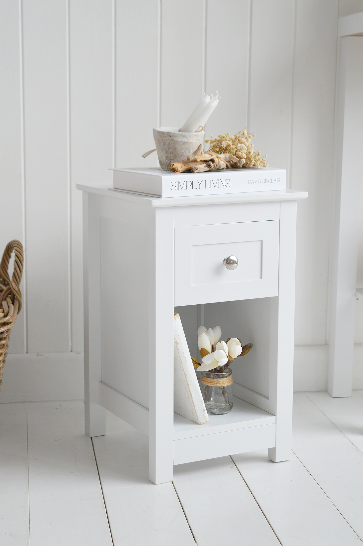 Perfect for neutral bedroom styling, the Whitby bedside table pairs beautifully with white wooden floors and soft layered textiles.
