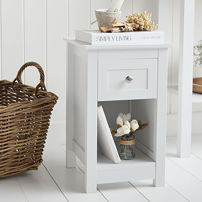 The Whitby slim white bedside table is ideal for modern country, coastal, New England and elegant neutral bedroom spaces.