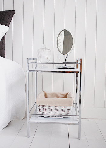 Shows the white and chrome bedside table as a small vanity area