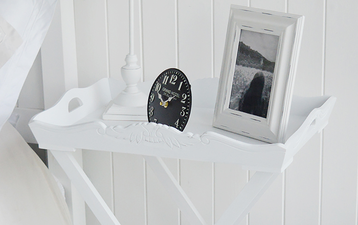 Close up photograph of tray in white bedside table